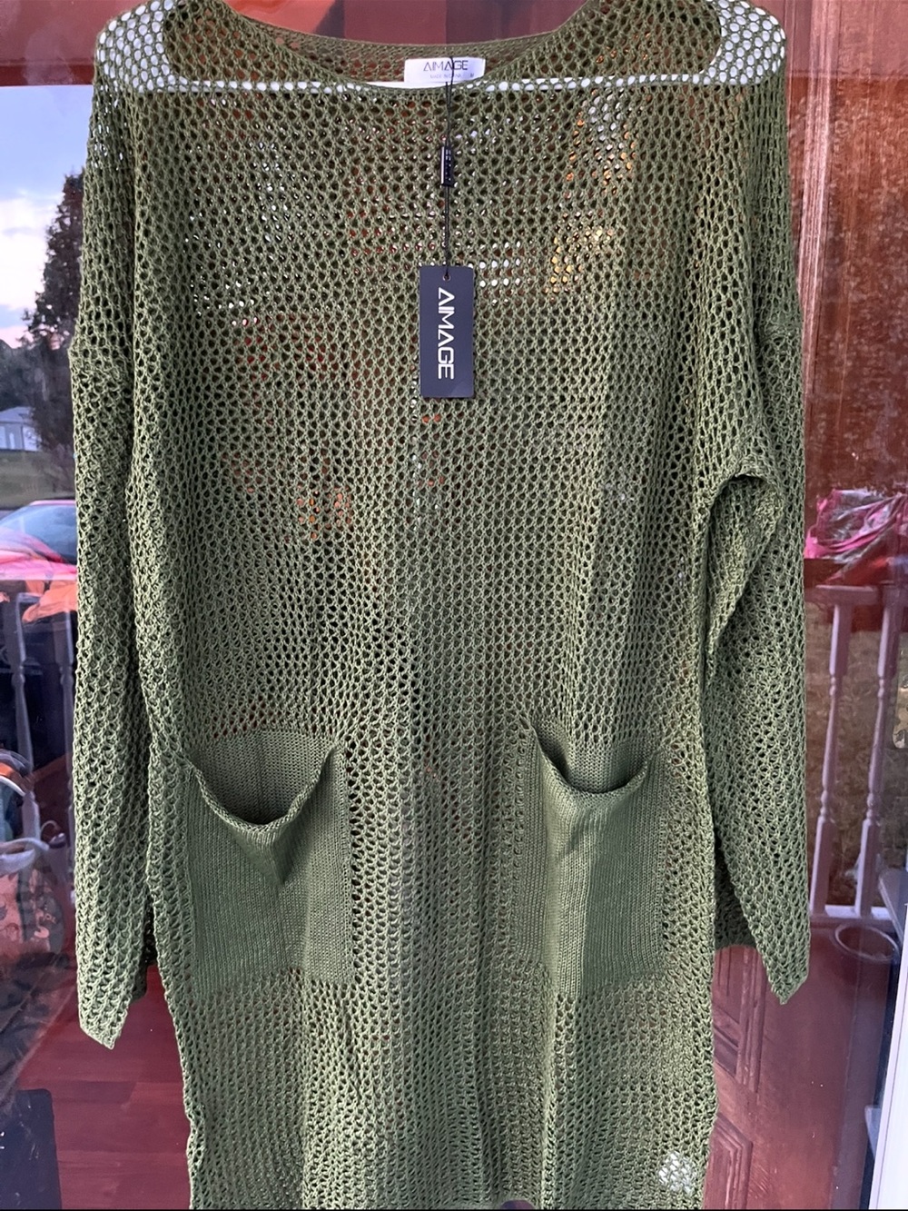 Anage Olive Open-Knit Pocket Tunic Sweater could be a swim coverup
